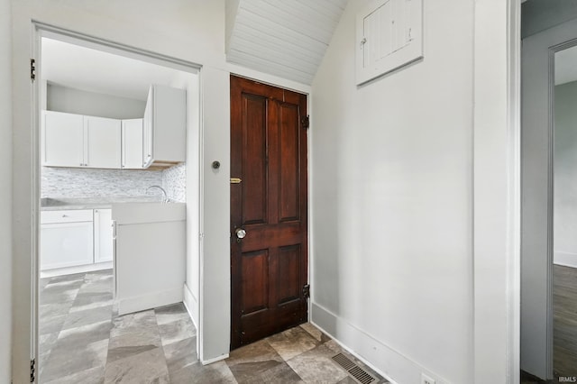 501 E Center St, Warsaw, IN 46580 - entryway featuring lofted ceiling and baseboards