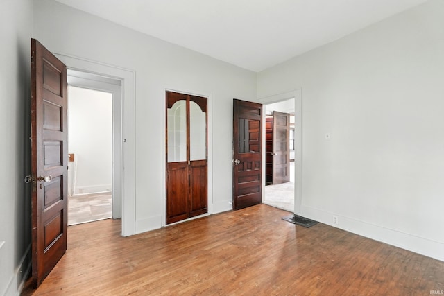 501 E Center St, Warsaw, IN 46580 - unfurnished bedroom featuring light wood-style floors and baseboards