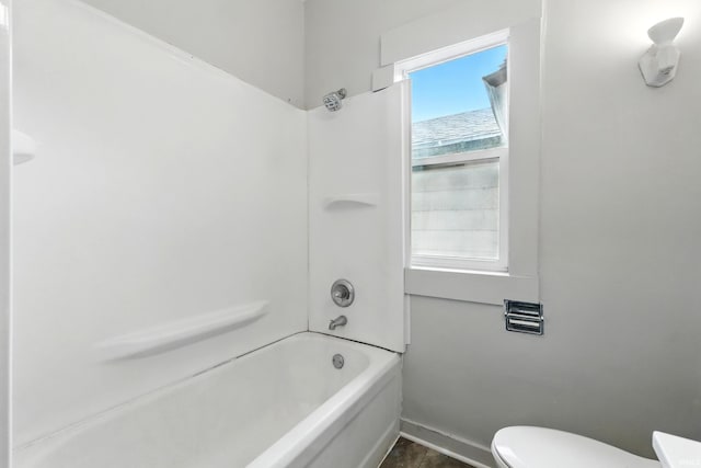 501 E Center St, Warsaw, IN 46580 - bathroom featuring toilet and tub / shower combination