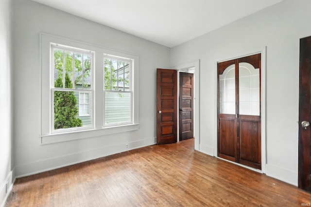 501 E Center St, Warsaw, IN 46580 - unfurnished bedroom featuring hardwood / wood-style flooring and a closet