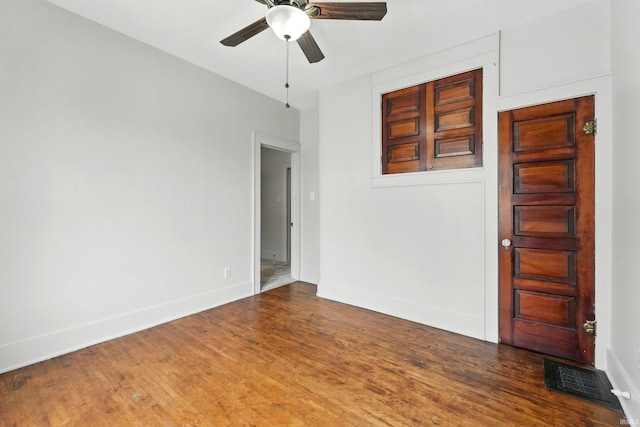 501 E Center St, Warsaw, IN 46580 - unfurnished room featuring a ceiling fan and wood finished floors