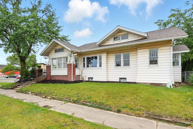501 E Center St, Warsaw, IN 46580 - view of front of property with a front yard and a shingled roof
