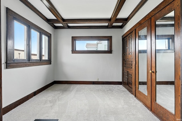 501 E Center St, Warsaw, IN 46580 - carpeted spare room with french doors, coffered ceiling, and beam ceiling