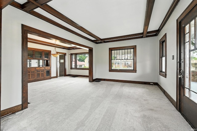 501 E Center St, Warsaw, IN 46580 - unfurnished living room with light carpet and beam ceiling