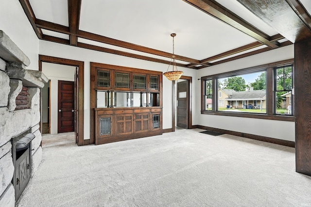 501 E Center St, Warsaw, IN 46580 - unfurnished living room with light carpet, beamed ceiling, coffered ceiling, and a stone fireplace