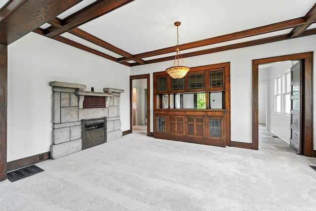 501 E Center St, Warsaw, IN 46580 - unfurnished living room featuring carpet floors, coffered ceiling, beam ceiling, a fireplace, and a chandelier