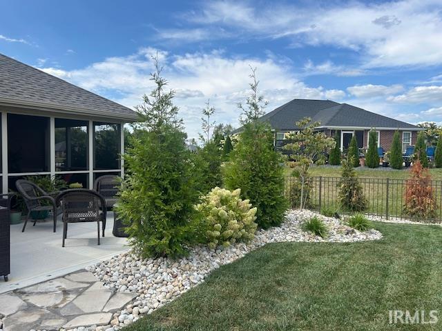 855 Reyling Dr, Jasper, IN 47546 - view of yard featuring a patio area and a sunroom
