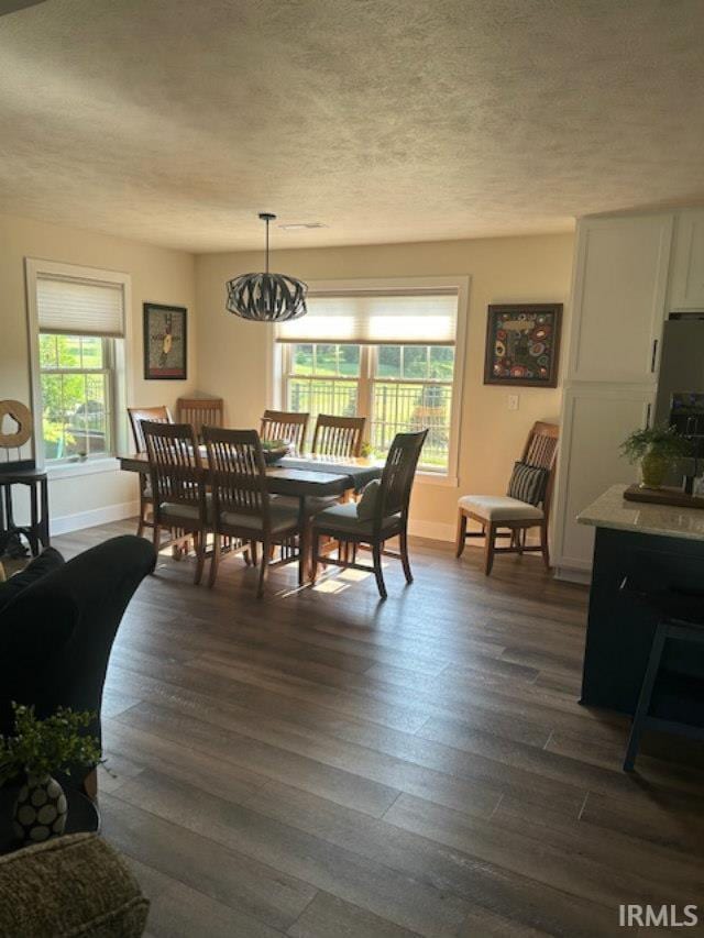 855 Reyling Dr, Jasper, IN 47546 - dining area with a textured ceiling and dark wood finished floors