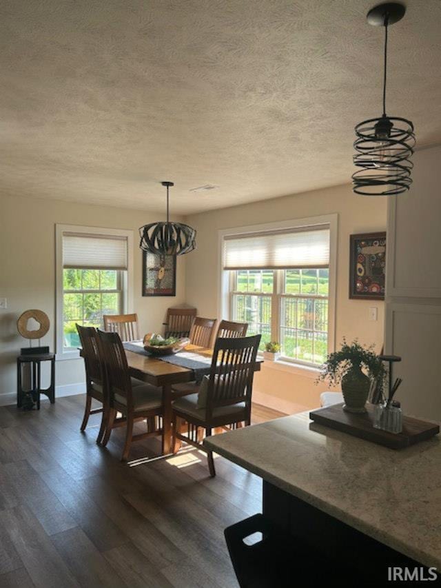 855 Reyling Dr, Jasper, IN 47546 - dining space with a textured ceiling and dark wood-style floors