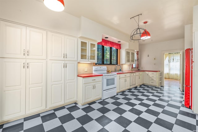 2131 Kensington Blvd, Fort Wayne, IN 46805 - kitchen featuring white appliances, dark flooring, plenty of natural light, and glass insert cabinets