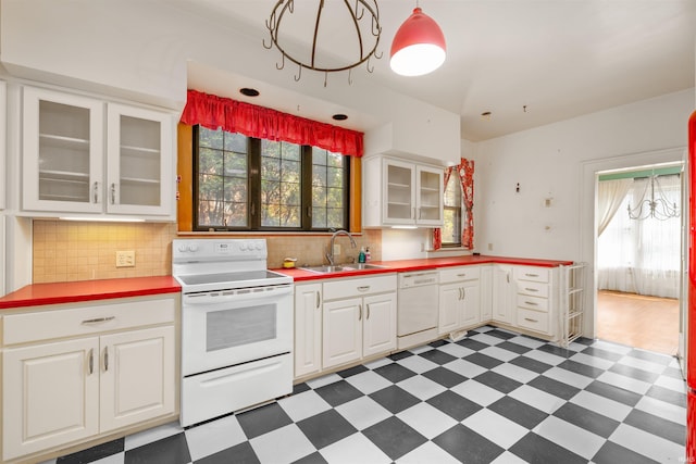 2131 Kensington Blvd, Fort Wayne, IN 46805 - kitchen featuring white appliances, tile patterned floors, white cabinetry, and tasteful backsplash