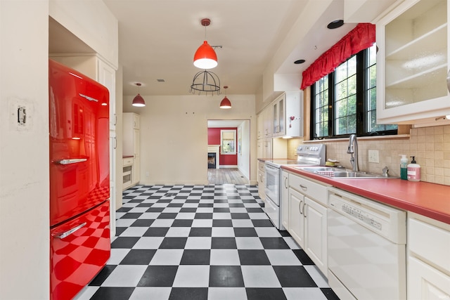 2131 Kensington Blvd, Fort Wayne, IN 46805 - kitchen featuring white appliances, dark floors, white cabinets, glass insert cabinets, and backsplash