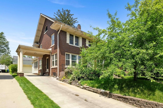 2131 Kensington Blvd, Fort Wayne, IN 46805 - view of front facade with a chimney and brick siding