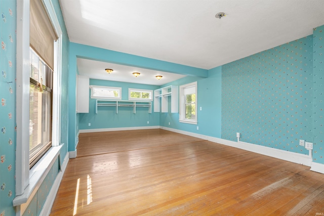 2131 Kensington Blvd, Fort Wayne, IN 46805 - spare room with wallpapered walls, light wood-style flooring, and a pendent fire sprinkler