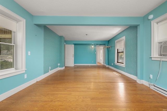 2131 Kensington Blvd, Fort Wayne, IN 46805 - spare room featuring light wood-style flooring, healthy amount of natural light, a smoke detector, and wallpapered walls
