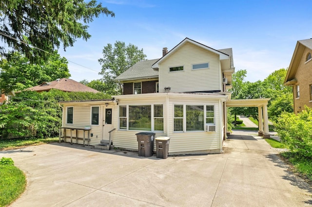 2131 Kensington Blvd, Fort Wayne, IN 46805 - back of property with entry steps, a patio area, a chimney, and a shingled roof