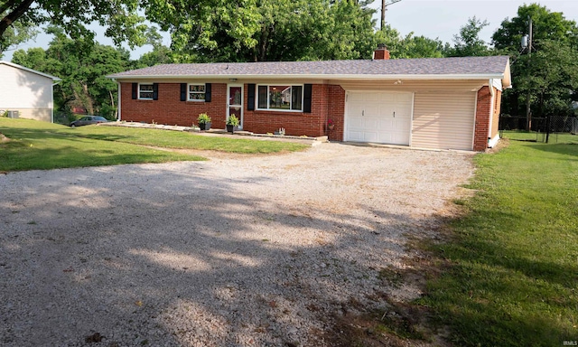 3945 W Walnut Leaf Dr, Bloomington, IN 47403 - single story home with a garage, a chimney, brick siding, and gravel driveway