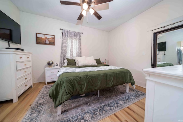 2220 N Huntington Rd, Marion, IN 46952 - bedroom with light wood-style flooring and a ceiling fan