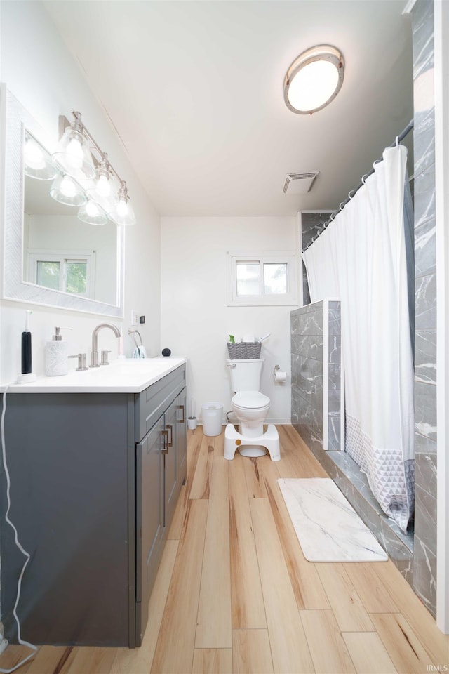 2220 N Huntington Rd, Marion, IN 46952 - full bath featuring vanity, wood finished floors, a shower with curtain, and healthy amount of natural light