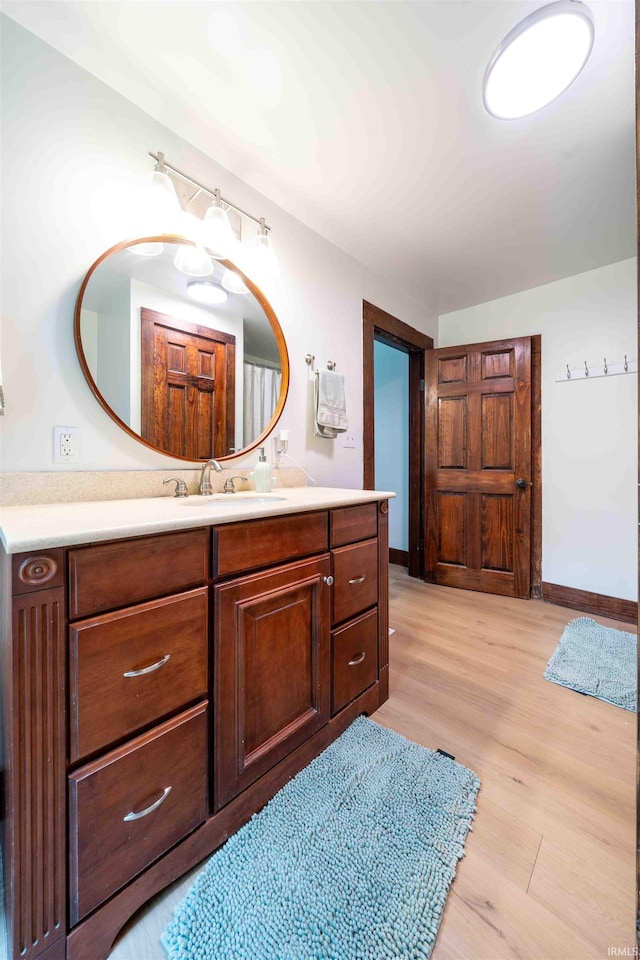 2220 N Huntington Rd, Marion, IN 46952 - bathroom with vanity and wood finished floors