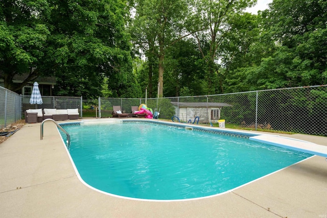 2220 N Huntington Rd, Marion, IN 46952 - view of swimming pool featuring a diving board, a patio area, and view of wooded area
