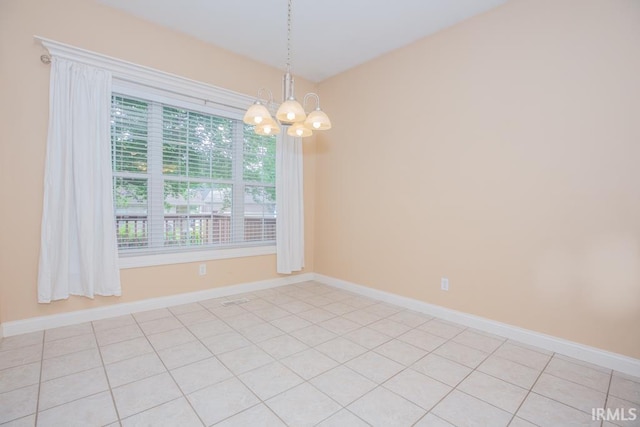 2433 Wheaton Dr, Evansville, IN 47725 - spare room featuring a chandelier and baseboards
