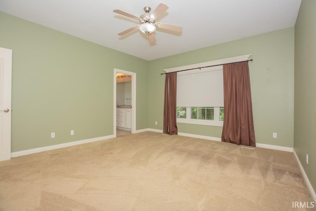 2433 Wheaton Dr, Evansville, IN 47725 - unfurnished bedroom with carpet, ceiling fan, and connected bathroom