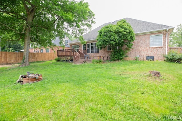 2433 Wheaton Dr, Evansville, IN 47725 - view of yard featuring a deck and an outdoor fire pit