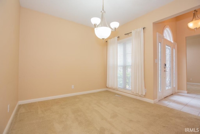 2433 Wheaton Dr, Evansville, IN 47725 - empty room featuring carpet and a chandelier