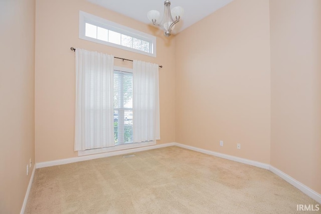 2433 Wheaton Dr, Evansville, IN 47725 - spare room with a chandelier and carpet