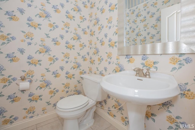 2433 Wheaton Dr, Evansville, IN 47725 - half bath with wallpapered walls and tile patterned floors