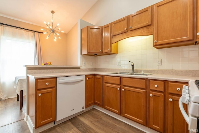 1423 W Westwind Ct, Bloomington, IN 47403 - kitchen featuring white dishwasher, a chandelier, brown cabinetry, and lofted ceiling