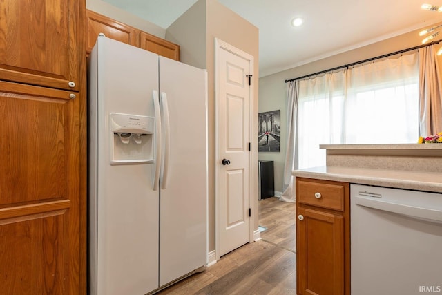 1423 W Westwind Ct, Bloomington, IN 47403 - kitchen featuring white appliances, brown cabinetry, light wood-style flooring, light countertops, and recessed lighting