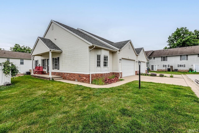1423 W Westwind Ct, Bloomington, IN 47403 - view of front of property with concrete driveway, a front lawn, a garage, a porch, and a shingled roof