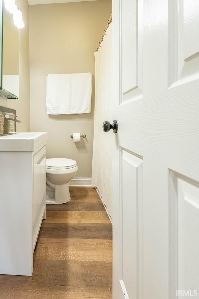 1423 W Westwind Ct, Bloomington, IN 47403 - bathroom with vanity and wood finished floors
