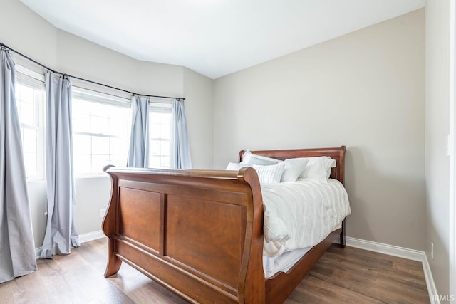 1423 W Westwind Ct, Bloomington, IN 47403 - bedroom with wood finished floors and baseboards