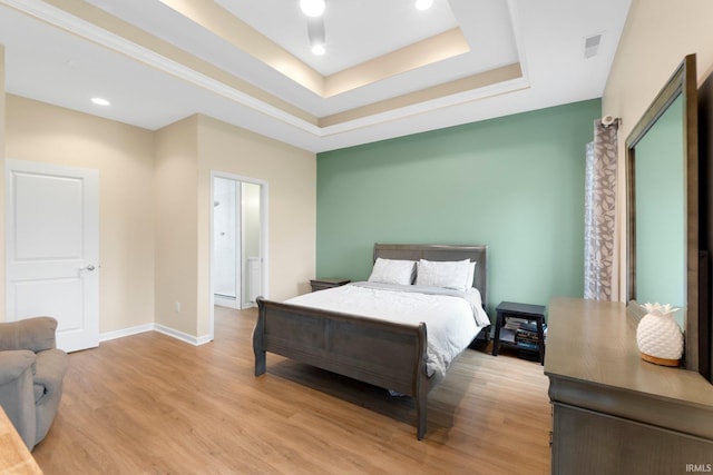 215 Mockingbird Ln, Warsaw, IN 46580 - bedroom with a raised ceiling, light wood-style flooring, and recessed lighting