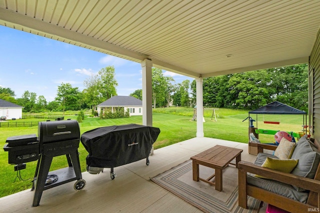 215 Mockingbird Ln, Warsaw, IN 46580 - view of patio featuring an outdoor hangout area and grilling area