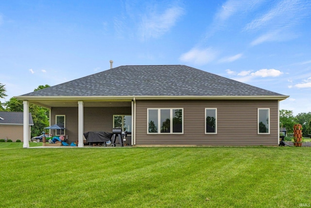 215 Mockingbird Ln, Warsaw, IN 46580 - rear view of house with a yard and roof with shingles