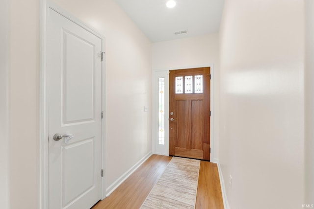 215 Mockingbird Ln, Warsaw, IN 46580 - foyer featuring light wood-style flooring and baseboards