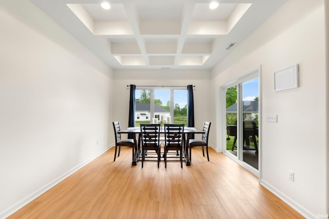 215 Mockingbird Ln, Warsaw, IN 46580 - dining space featuring coffered ceiling, healthy amount of natural light, light wood-style floors, and beam ceiling