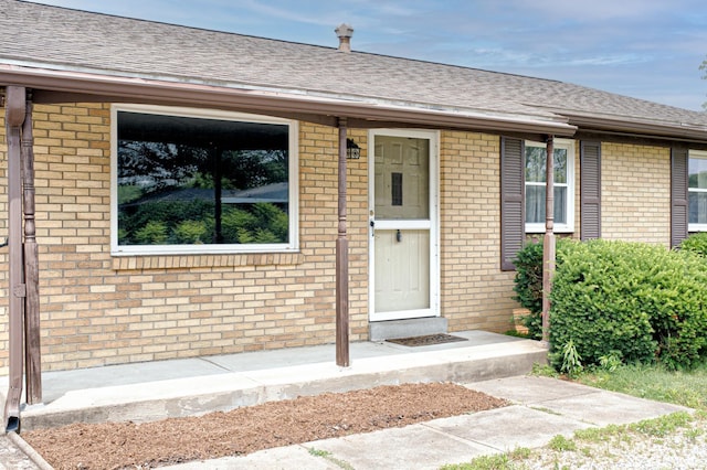6412 E Oak St, Evansville, IN 47715 - property entrance with brick siding and roof with shingles