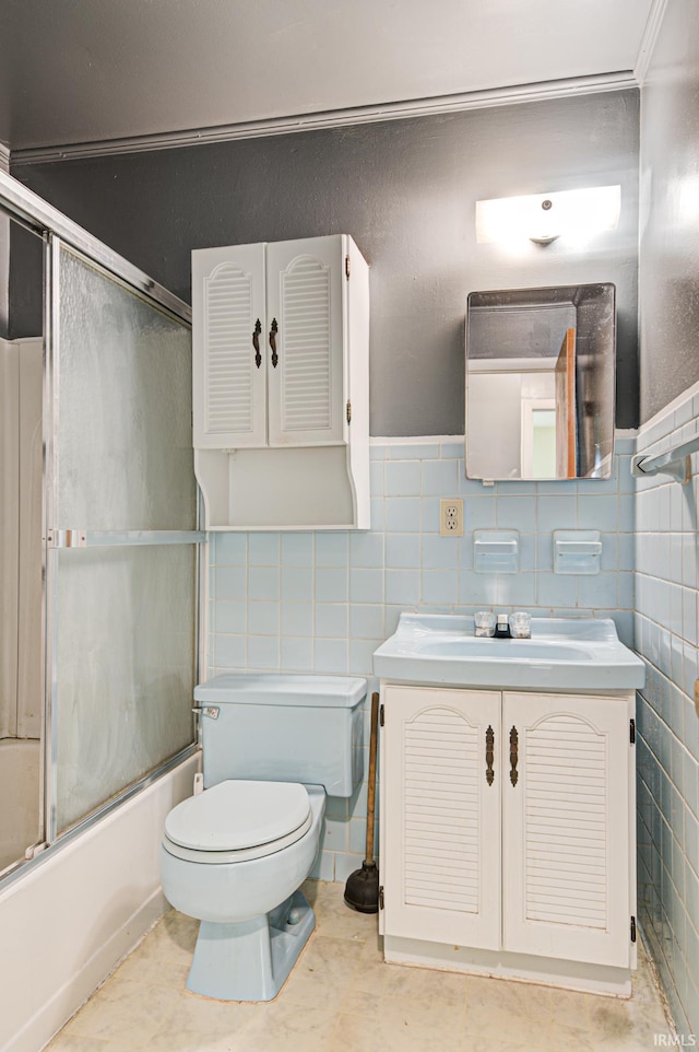 6412 E Oak St, Evansville, IN 47715 - full bath featuring vanity, enclosed tub / shower combo, and tile walls
