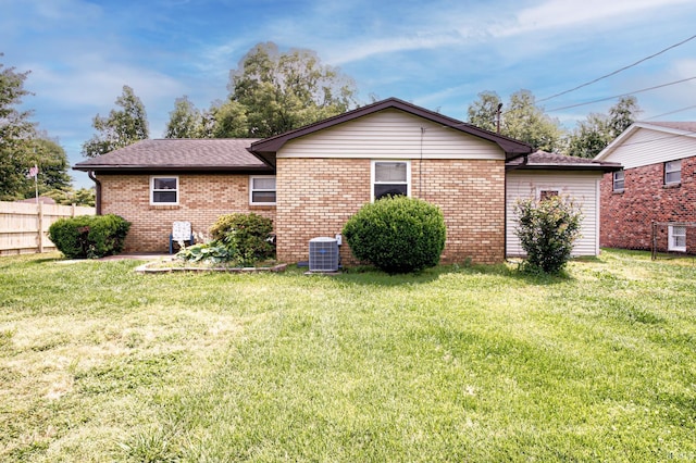 6412 E Oak St, Evansville, IN 47715 - rear view of house featuring brick siding and a shingled roof