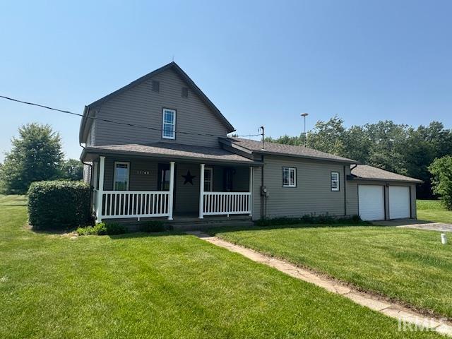 11748 W 450 N, Cromwell, IN 46732 - view of front of house featuring a porch and a front lawn