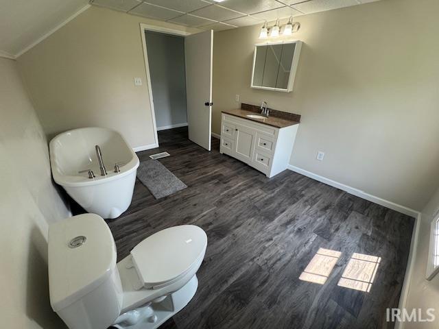 11748 W 450 N, Cromwell, IN 46732 - bathroom with vanity, wood finished floors, a freestanding tub, and a drop ceiling