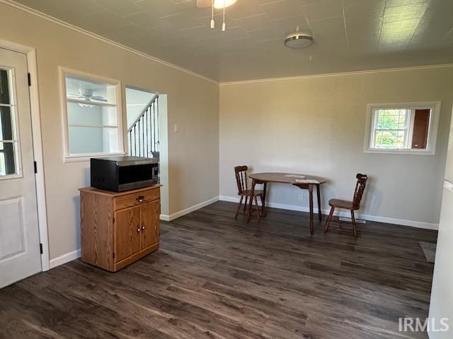 11748 W 450 N, Cromwell, IN 46732 - dining room with dark wood-style flooring, crown molding, and stairs