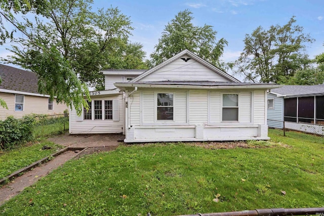 2305 N Armstrong St, Kokomo, IN 46901 - back of property with a yard and a sunroom