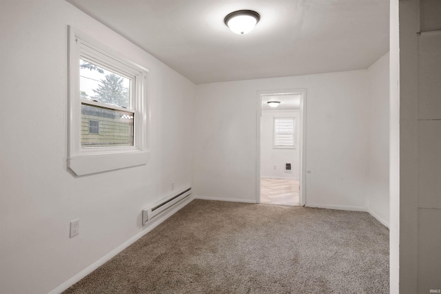 2305 N Armstrong St, Kokomo, IN 46901 - spare room with a baseboard heating unit and carpet flooring