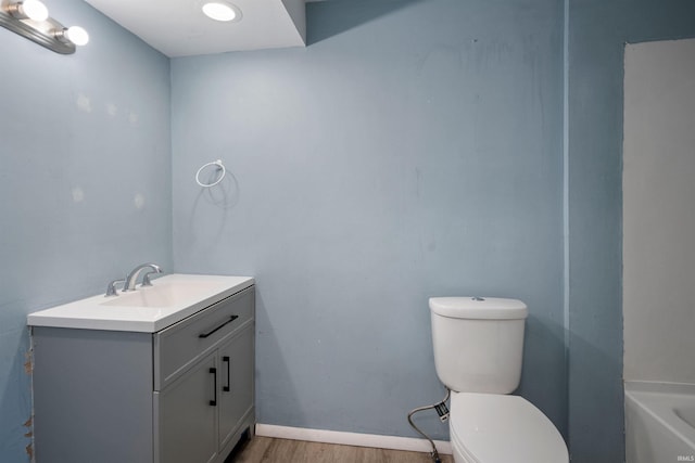 2305 N Armstrong St, Kokomo, IN 46901 - full bathroom with vanity, wood finished floors, and a tub